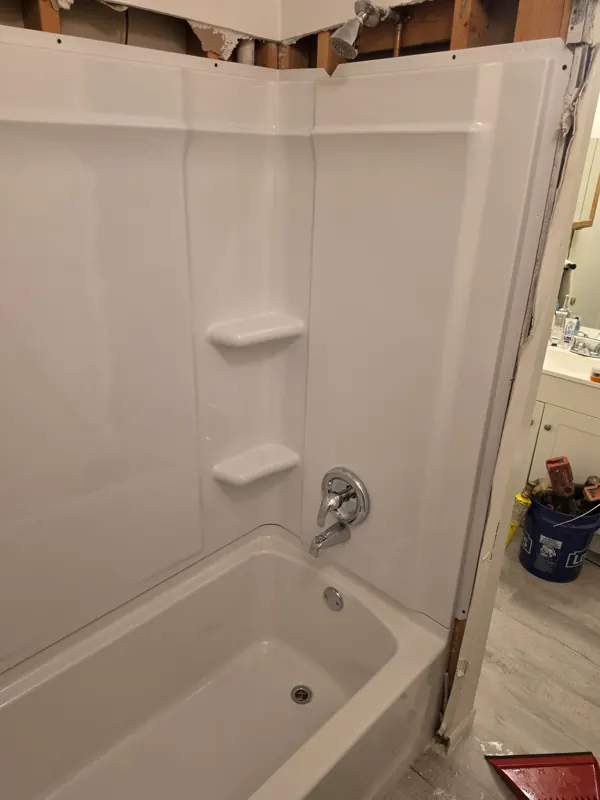 The finished tub surround with the new valve trim and spout