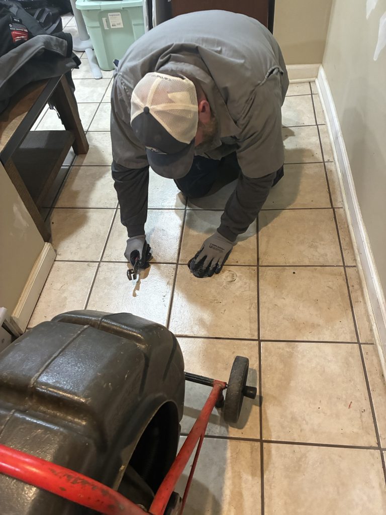 Plumber performing on-site work